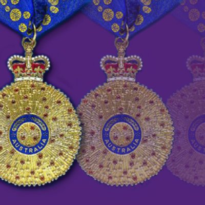 Order of Australia medals on a purple background